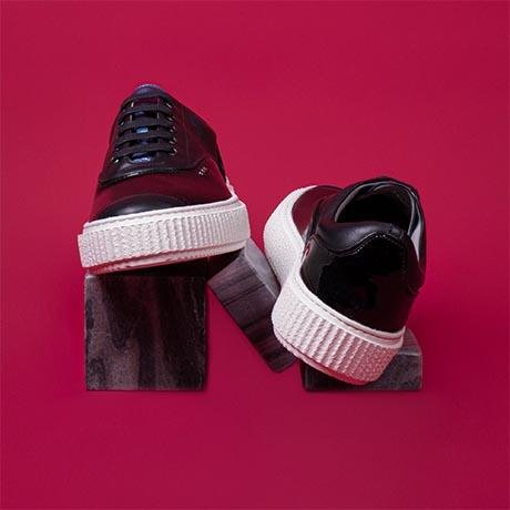Black patent top sneakers for ladies
