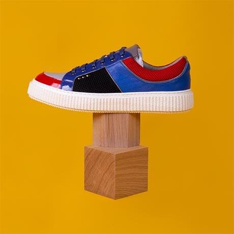 ME.LAND Red, black, blue and grey DEAKER sneaker side view